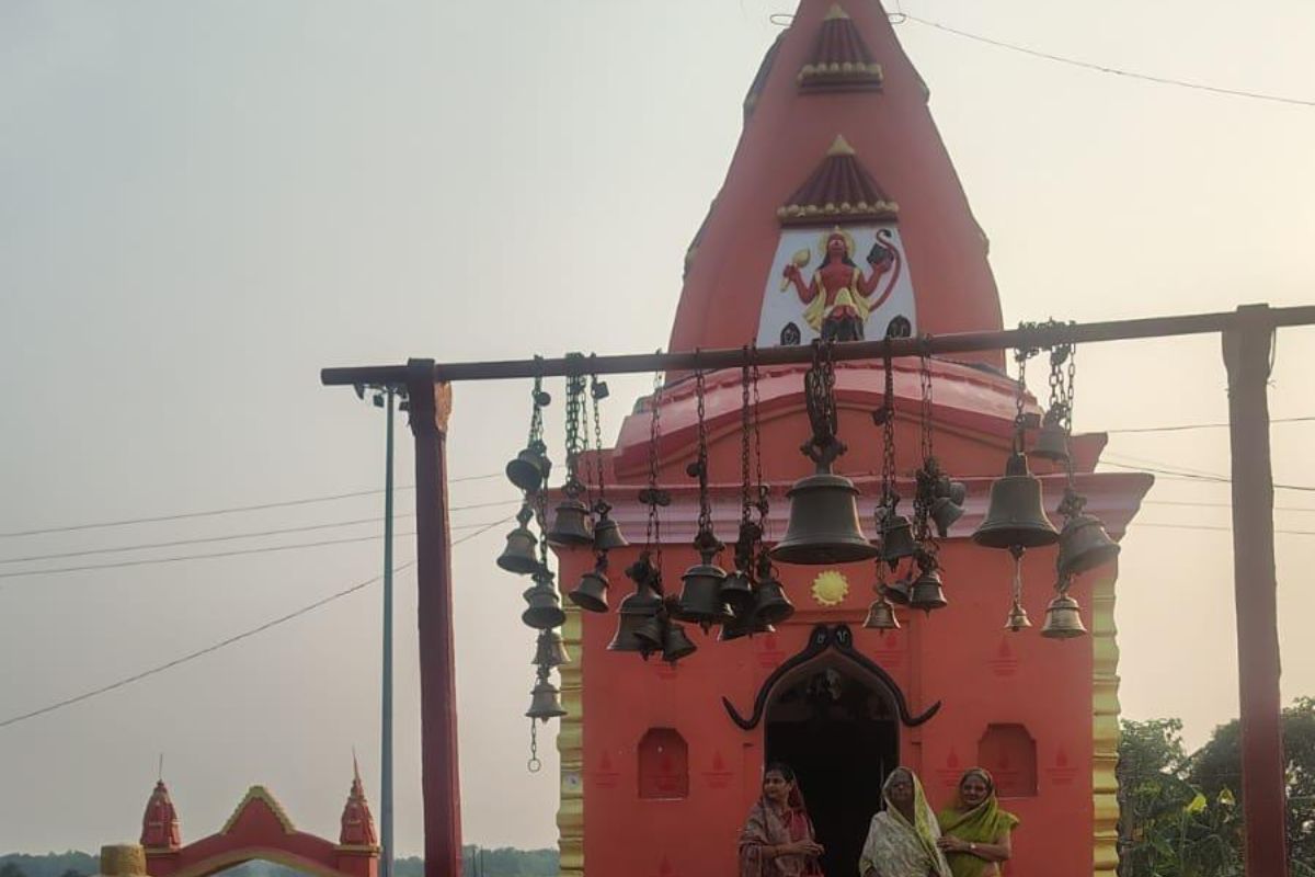 Temple tower and hanging bells in a Prabhat Khabar photograph